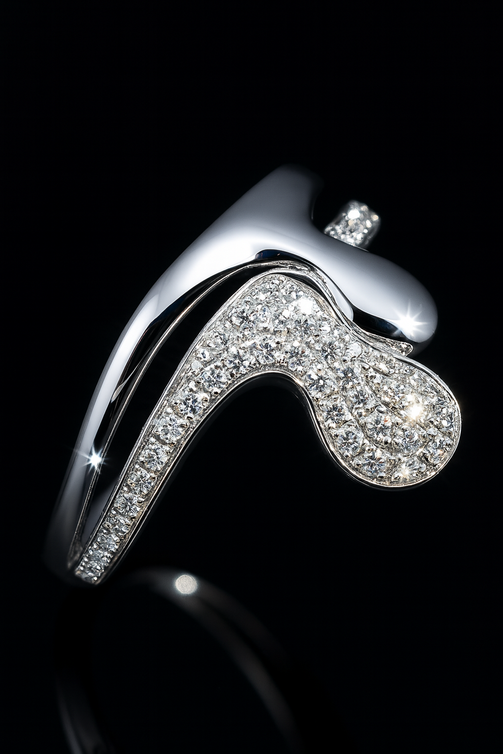 Silver high-heeled shoe charm with rhinestones on a black background